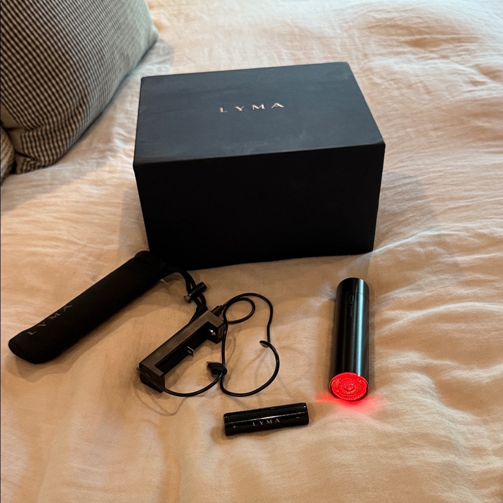 Lyma Laser. Includes batter, pouch, authenticity card and original box